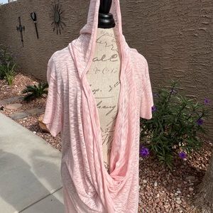 Pink hooded top with hi low hemline. New. Never worn.
